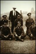 Group photograph of six unidentified World War I soldiers with Dr. Ord