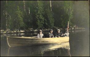 Three American fishermen in wooden motorized boat