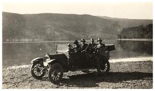 Group in car on beach above Quilchena on Nicola Lake