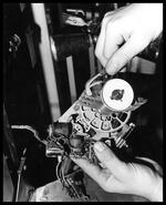 Okanagan Telephone employee working on gears