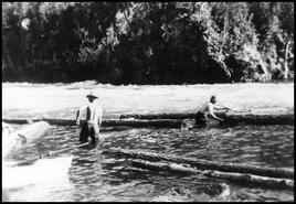 Henry and Wilfred Simard on log drive in the river