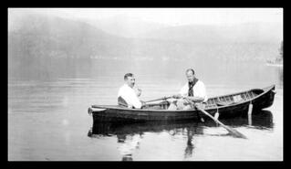 A. Fleetwood-Wilson and unidentified man in a canoe on Okanagan Lake, Carr's Landing