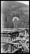 Worker posing at Shuswap Falls dam construction