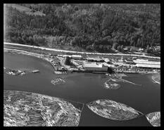 Aerial view of sawmill and log booms at the Saskatchewan Co-op sawmill, Canoe, B.C.