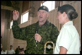 General Walter Natynczyk presents Enderby cadet Blythe Heywood with coin