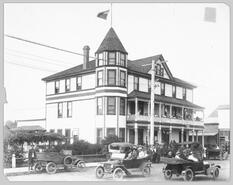 Soldiers and cars in front of Okanagan House Hotel