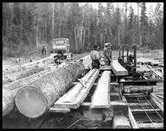 Sawing bridge timbers during construction of Big Bend Highway