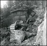 Bulldozer in rock slide