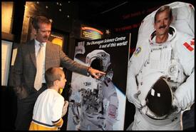 Canadian astronaut Chris Hadfield checks out a display at the Okanagan Science Centre