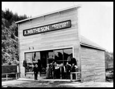 Mrs. Dartt in group in front of A. Matheson's store