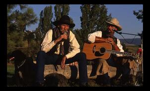 Cowboys Dave Longworth and Bryn Thiessen performing poetry at O'Keefe Ranch