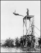 Postcard showing troops from Camp Vernon diving off the diving tower at Kal Beach