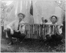Roy Wheeler and Henry Hendrickson with rack of fish