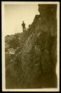 Man standing on the edge of a cliff