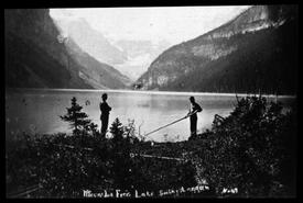 Two men on the shore of Lake Louise
