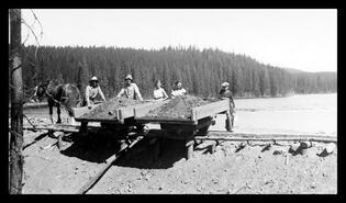 Verner McDonagh and group building dam at Dee Lake above Winfield