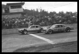 Bruce Georgeson driving the Evergreen Tire car across the finish line at Tillicum Raceway