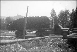 Baird Bros. truck with a load of fence posts