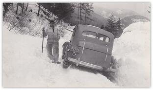 Unidentified man with car stuck in snow