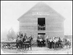 Joe Harwood Livery Express barn with teamsters and children standing in front