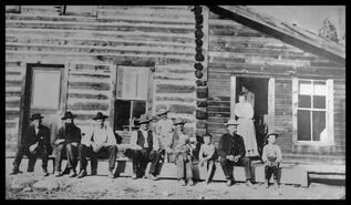 Group in front of Eagle City Hotel located north of Grand Forks
