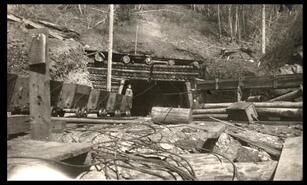 Coal cars at log entrance to mine at Blakeburn, Coalmont