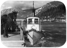 Taking equipment to Nakusp via boat, Beaton in background