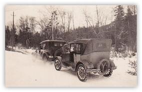 Basil Hartley's cars on a snowy road