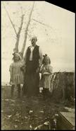 At Ole Johnson's - Man with two young girls, ca. 1910
