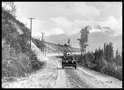 Automobile on Moran Road with Mount Begbie in the background