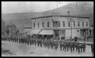 Tobias' Tigers, World War I troops parade in front of H.G. Parson's store