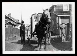 Milkman A.J. Bryant with his milk wagon