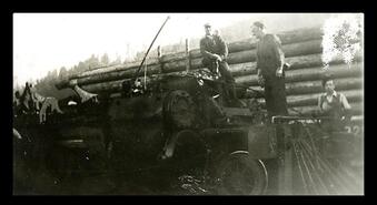 Men with steam engine and log train, unknown location