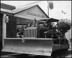 Man sitting at the controls of a 1948 TD-14 International Isaacson bulldozer