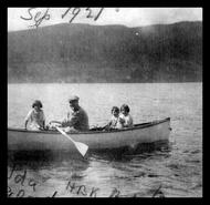 Group in row boat on Okanagan Lake