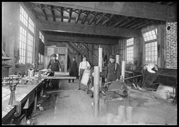 Group of men working in Mark Dummond's Tin Shop
