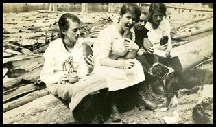 Four unidentified young women at a picnic, Big Eddy, Columbia River