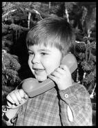 Okanagan Telephone publicity photograph of a boy and telephone
