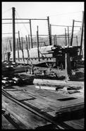 C.P.R. dockyard with barges and lumber