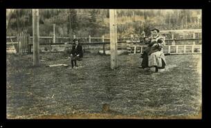 Woman and children on swings at Procter