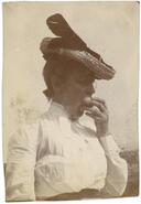 Unidentified woman eating fruit]