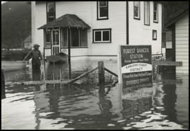 Alan Sim in front of the Forestry Office during 1948 Sicamous flood