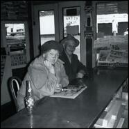 Winnie Couldry and Bill Webb inside Svendsen's Magazine Shop