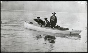 Walter Clough and two others in boat