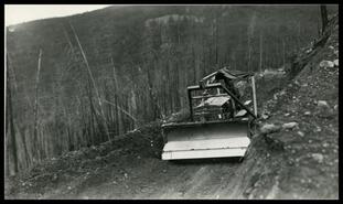 Front view of logging tractor going downhill