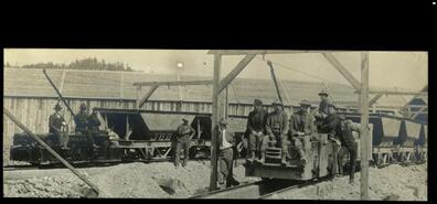 Men on railway mining car at Granby Mine