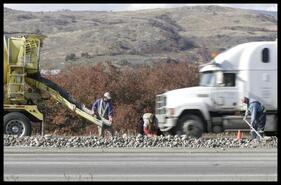 Crews pour concrete into place as part of the beautification project along Highway 97's Swan Lake corridor