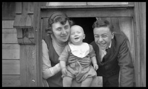 Man presumed to be Earle and Estelle Dickey with baby