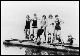 Group of swimmers on wooden platform
