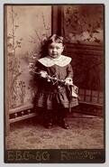 Unidentified child posing with toy